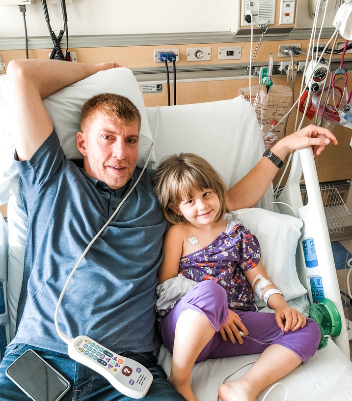 dad and child in hospital bed 