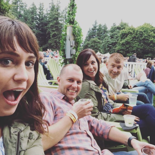 four adults at vance joy concert 