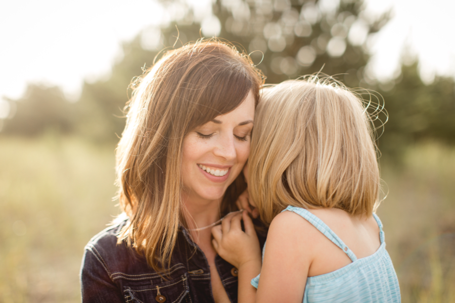 Mother holding daughter with pediatric cancer