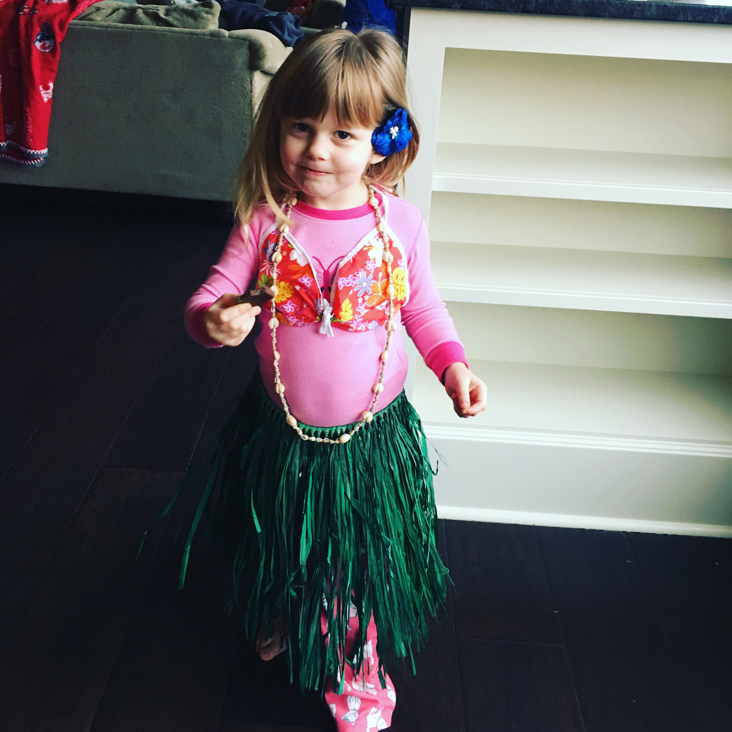 little girl in luau dress