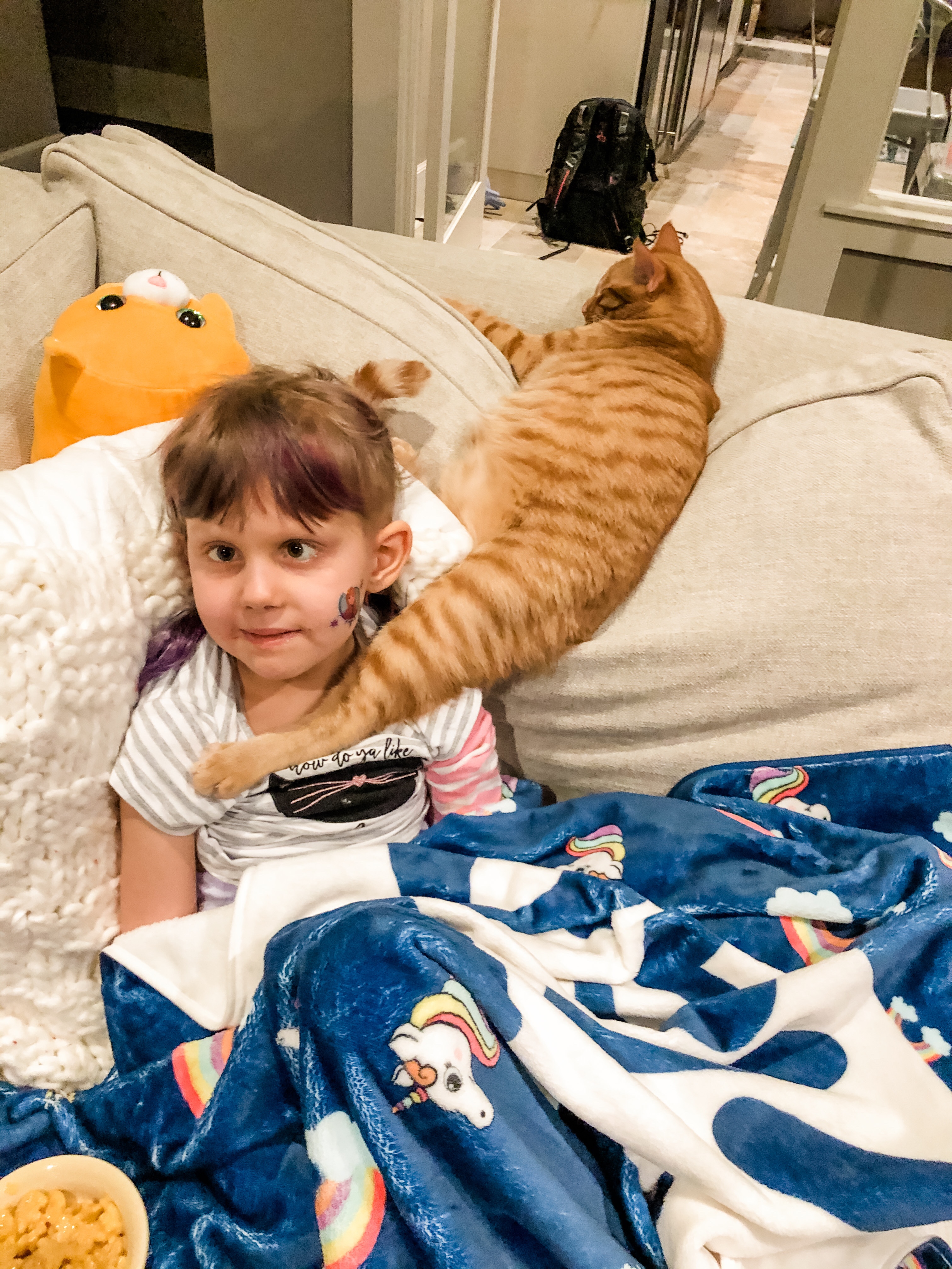 DIPG warrior Dylan sits with cat