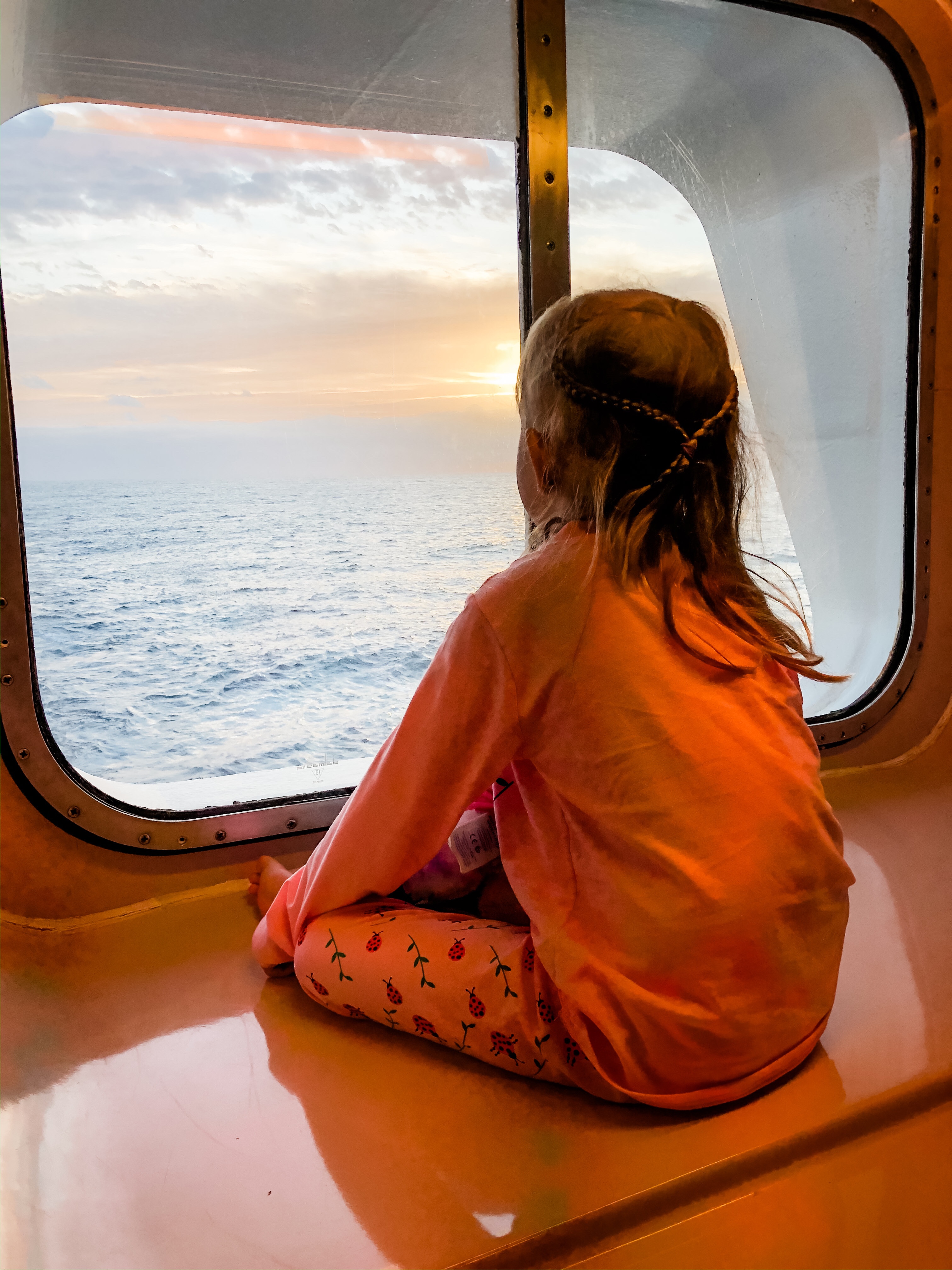 Dylan Jude looks out at the ocean on a cruise ship 