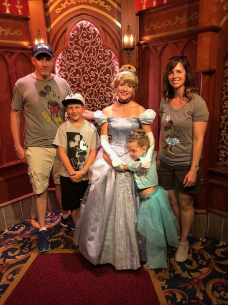Dylan and family with Cinderella at Make a Wish trip